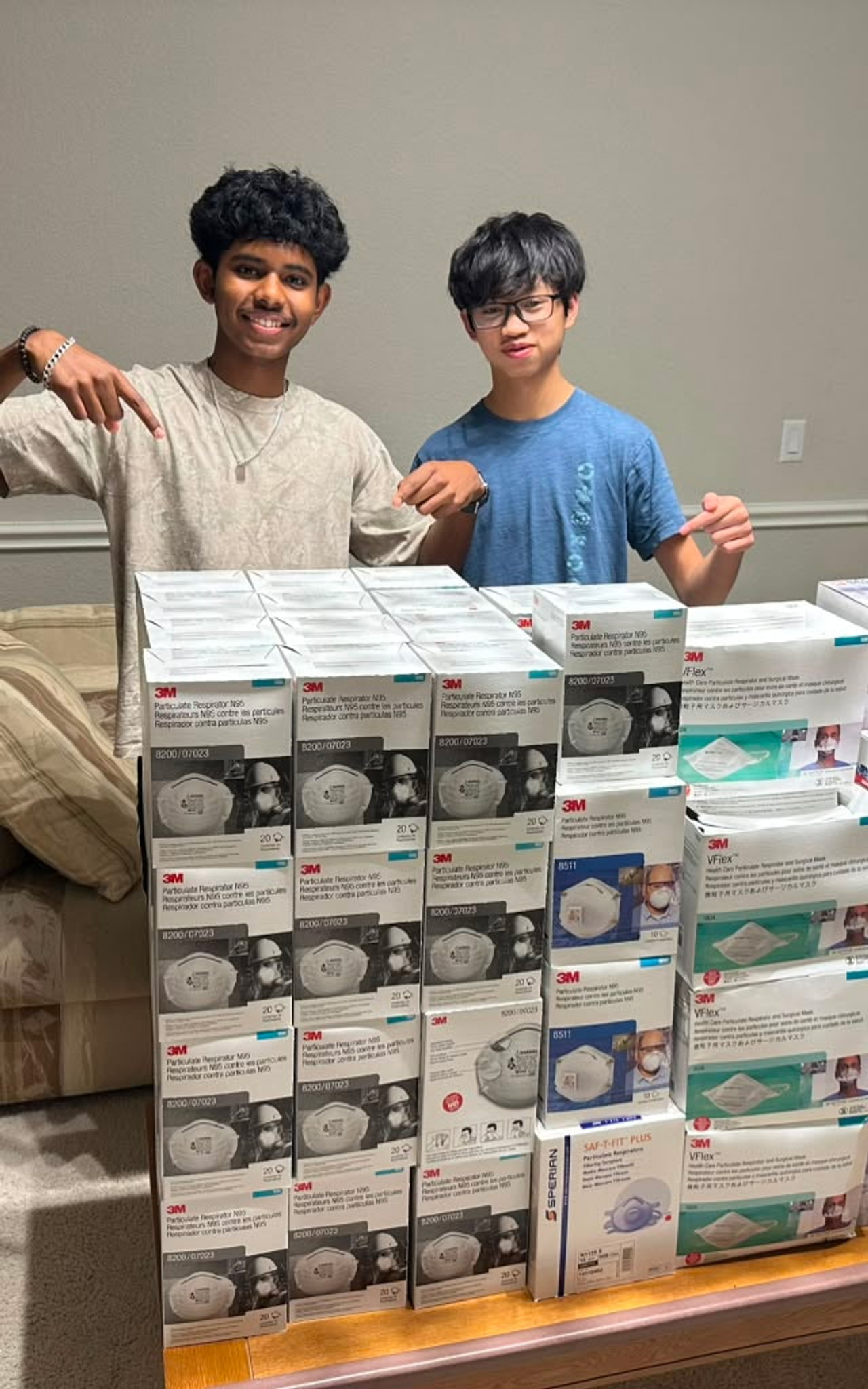 Clinical Bridge students with collected boxes of masks